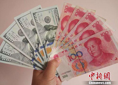 資料圖：人民幣和美元。<a target='_blank'  _fcksavedurl='http://www.chinanews.com/' ></table>中新網(wǎng)</a>記者 李金磊 攝